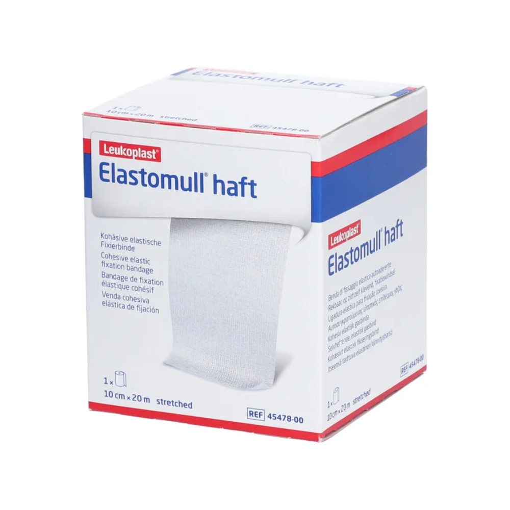 Eine Schachtel BSN Elastomull® haft, elastische Fixierbinde von BSN medical GmbH (essity). Die weiße Schachtel mit blauen und roten Akzenten zeigt auf der Vorderseite ein Bild der Binde. Der Text gibt an, dass die Binde im gedehnten Zustand 10 cm x 20 m misst.